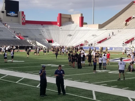 Crowd photo of tower challenge event, featuring first responders, military, and community members