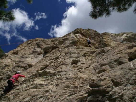 Climber scaling a mountain wall