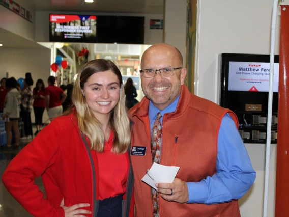 Troy Vaughn taking a photo with event attendee