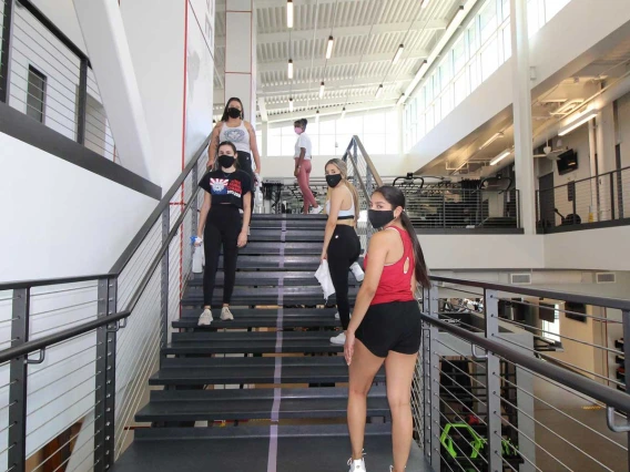 Group of patrons walking up staircase