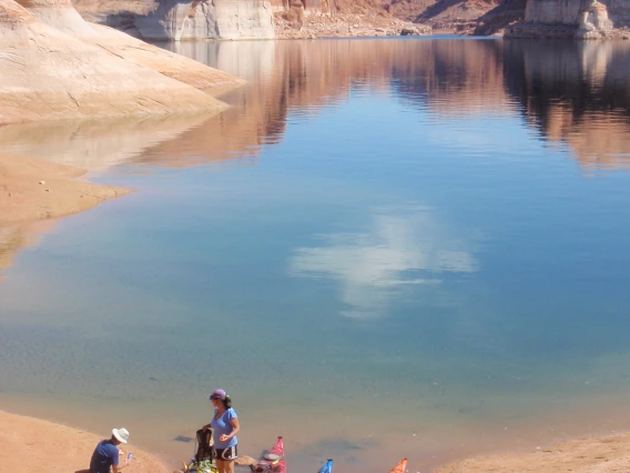 Group of kayakers on the shore of a lake