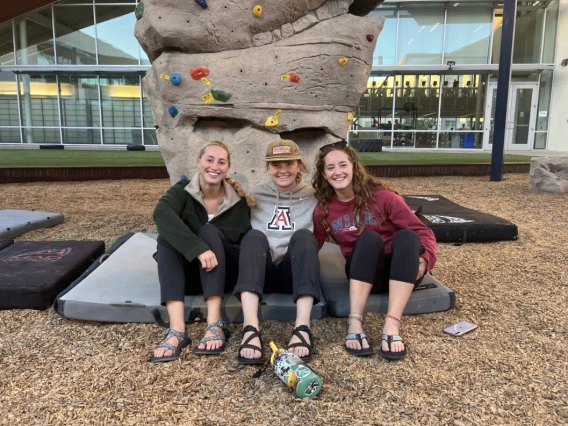 Group seating in front of boulder wall