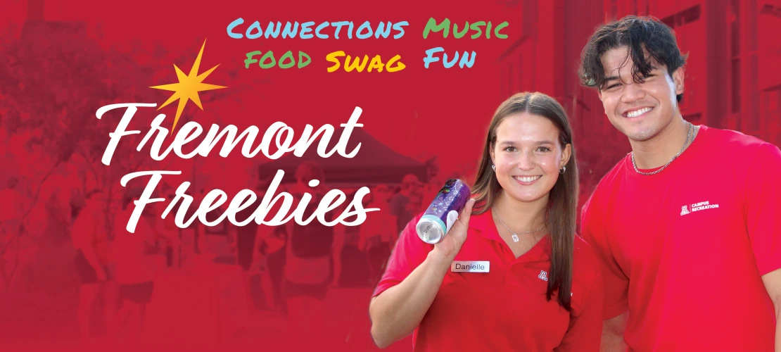 Campus rec employees holding freebies
