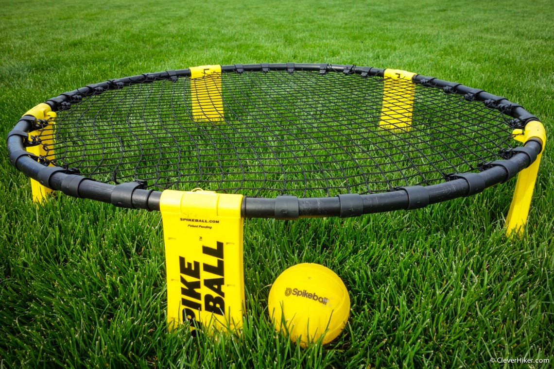 Spikeball and spikeball net sitting on grass