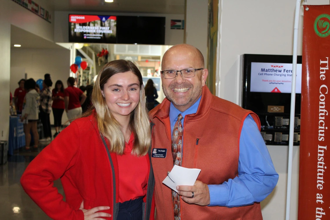 Troy Vaughn taking a photo with event attendee