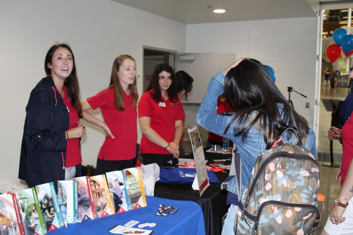 Students visiting informational booth at Campus Rec during diversity event