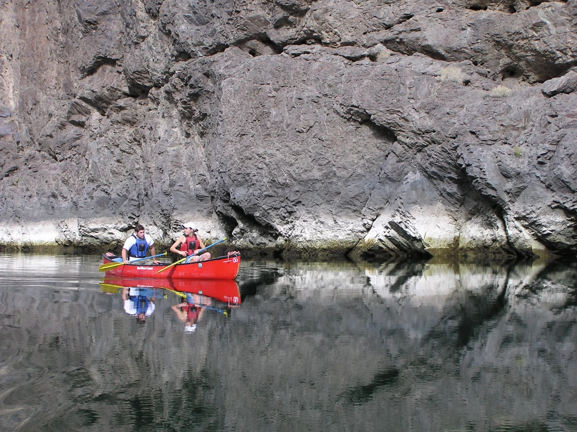 Pair of people canoeing in a river