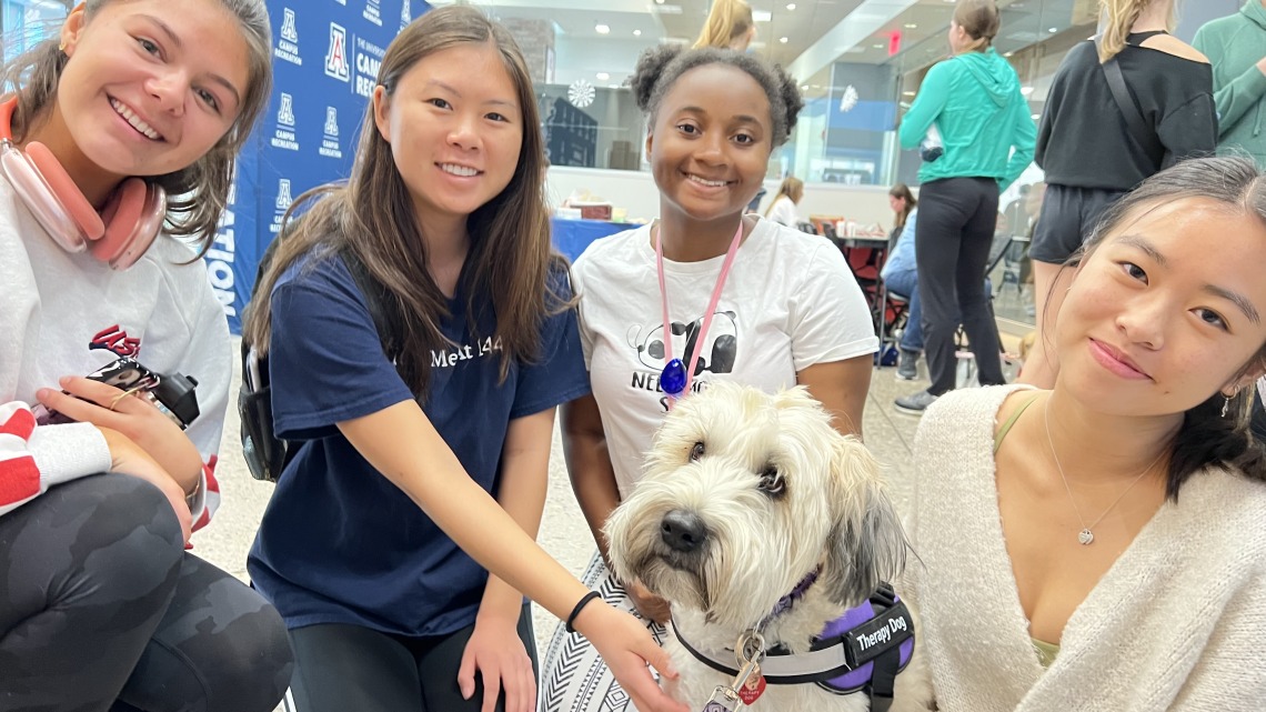Students with Molly the Therapy Dog