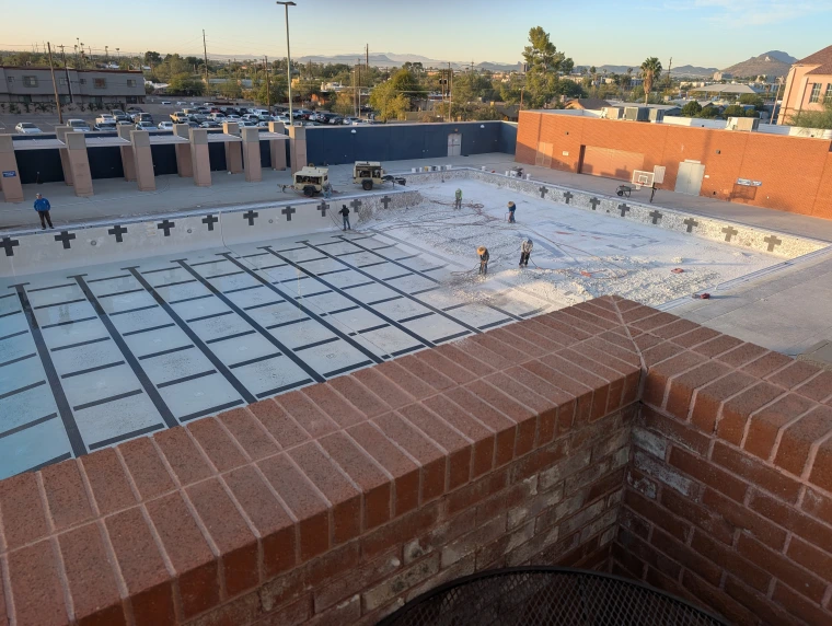 Photo of empty pool being renovated