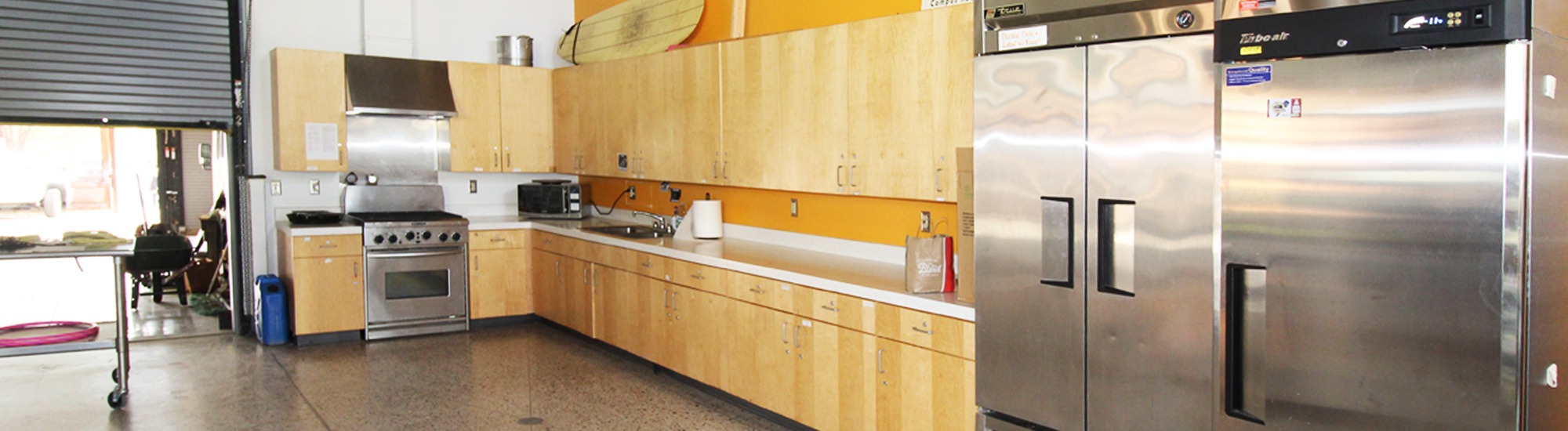 Kitchen featuring counters, stove, fridge, and freezer, at Outdoor Rec UArizona
