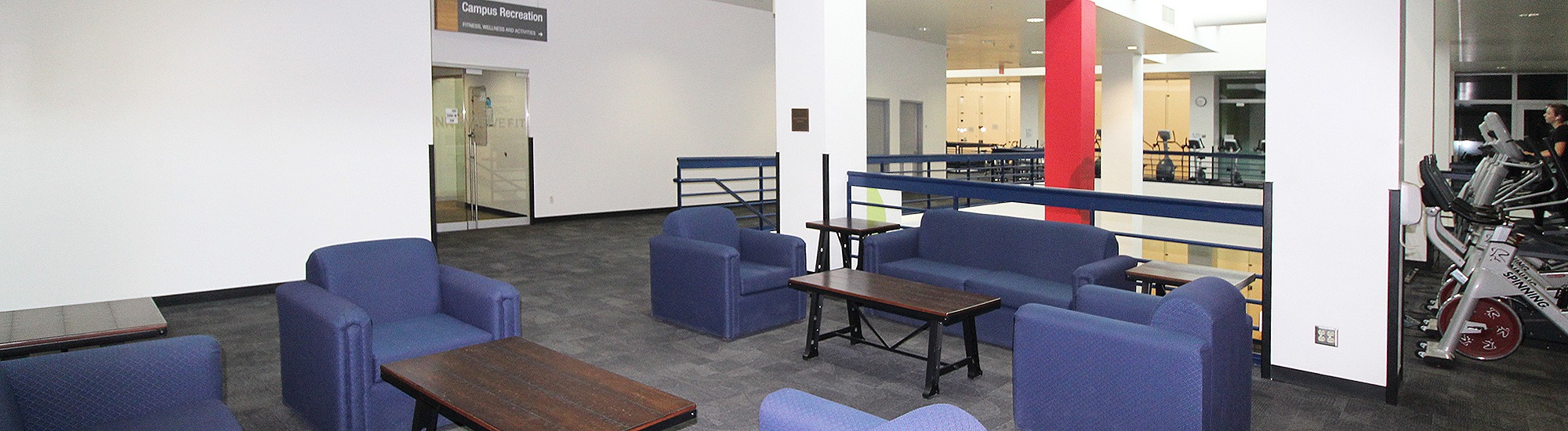 Lounge space with armchairs and tables at Campus Rec UArizona