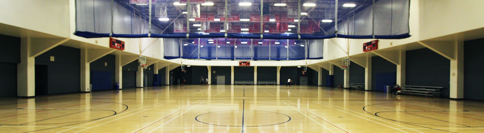Three basketball courts with raised dividers at Campus Rec, UArizona