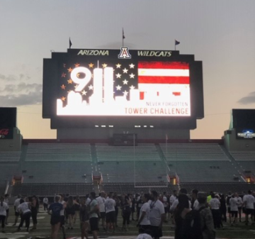 UArizona stadium screen displaying the 9/11 Tower Challenge logo
