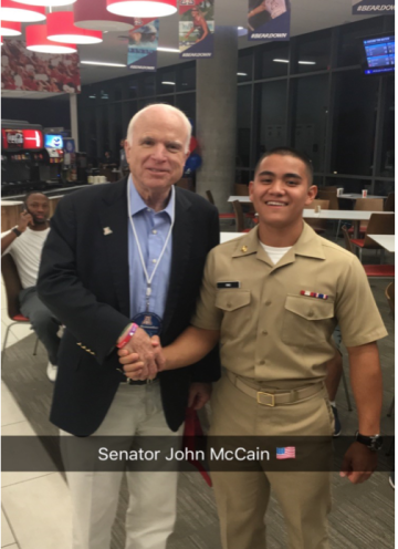 Ryan Ring in uniform, shaking hands with Senator John McCain
