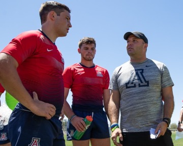 Sean Duffy coaching two rugby players