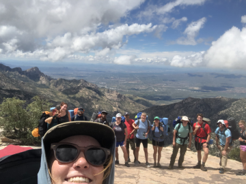 smiling backpacking group