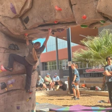 Female Participant Climbing on the boulder wall